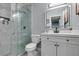 Modern bathroom features a glass shower, sleek vanity with illuminated mirror at 709 Jonathan Glen Way, Las Vegas, NV 89145
