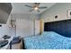 Cozy bedroom featuring a ceiling fan, closet, and comfortable bed with blue and white floral bedding at 709 Jonathan Glen Way, Las Vegas, NV 89145