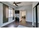 Bedroom featuring hardwood floors, ceiling fan, natural light and mounted TV at 709 Jonathan Glen Way, Las Vegas, NV 89145