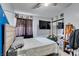 Bedroom featuring ceiling fan, mounted TV, and closet with sliding doors at 709 Jonathan Glen Way, Las Vegas, NV 89145