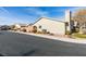 The side of this home shows the low maintenance landscaping and roof details at 709 Jonathan Glen Way, Las Vegas, NV 89145