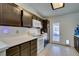 Galley kitchen with modern appliances and access to the backyard at 709 Jonathan Glen Way, Las Vegas, NV 89145
