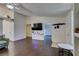 Open-concept living room with wood floors, a TV area, and easy access to the entry at 709 Jonathan Glen Way, Las Vegas, NV 89145