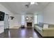 Cozy living room with fireplace, hardwood floors, and open layout at 709 Jonathan Glen Way, Las Vegas, NV 89145