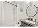 This bathroom has a shower and tub combo with a marble countertop vanity and decor at 7165 N Grand Canyon Dr, Las Vegas, NV 89149