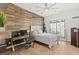 Bedroom with wood-paneled wall, a large window and desk at 7165 N Grand Canyon Dr, Las Vegas, NV 89149