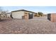 Large private driveway with multiple access gates that leads to the main home and a detached garage at 7165 N Grand Canyon Dr, Las Vegas, NV 89149