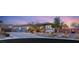 Beautiful single-story home boasting a three-car garage and desert landscaping at 7165 N Grand Canyon Dr, Las Vegas, NV 89149