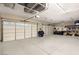 This spacious garage has epoxy floors and ample space for parking and storage at 7165 N Grand Canyon Dr, Las Vegas, NV 89149