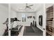 Home gym featuring modern exercise equipment, a ceiling fan, and a well-lit space at 7165 N Grand Canyon Dr, Las Vegas, NV 89149