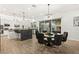 Open-concept kitchen with a large island, stainless steel appliances, and dining area at 7165 N Grand Canyon Dr, Las Vegas, NV 89149