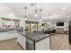 Modern kitchen with granite countertops, stainless steel appliances, and open layout at 7165 N Grand Canyon Dr, Las Vegas, NV 89149
