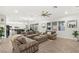 Spacious living room with a modern ceiling fan and ample natural light at 7165 N Grand Canyon Dr, Las Vegas, NV 89149