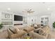 Comfortable living room with sleek fireplace, contemporary design, and wood-look floors at 7165 N Grand Canyon Dr, Las Vegas, NV 89149