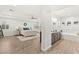 Serene main bedroom boasting natural light, wood-look floors, and ensuite bath access at 7165 N Grand Canyon Dr, Las Vegas, NV 89149