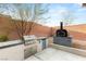 Outdoor kitchen area with stainless steel grill, side burner, and fridge, excellent for al fresco dining at 7165 N Grand Canyon Dr, Las Vegas, NV 89149