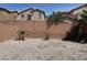 Backyard featuring desert landscaping, providing a low-maintenance outdoor space at 7246 Spring Flower Ave, Las Vegas, NV 89117