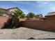The backyard offers privacy with a block wall and low maintenance desert landscaping at 7246 Spring Flower Ave, Las Vegas, NV 89117