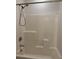 Bathroom shower and tub area with tile surround at 7246 Spring Flower Ave, Las Vegas, NV 89117