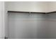 A simple and clean walk-in closet with a single hanging rod at 7246 Spring Flower Ave, Las Vegas, NV 89117