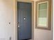 Front door with sidelight and digital door lock at 7246 Spring Flower Ave, Las Vegas, NV 89117