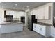 Spacious kitchen featuring white cabinets, stainless steel appliances, and a large island at 7246 Spring Flower Ave, Las Vegas, NV 89117