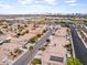 Panoramic aerial view of a residential area with tree-lined streets and mountain views at 7892 Nookfield Dr, Las Vegas, NV 89147