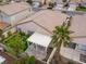 Backyard featuring a covered patio, green space, and mature palm tree at 7892 Nookfield Dr, Las Vegas, NV 89147