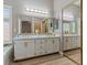 Bathroom features double sink vanity with modern lighting and a large mirror at 7892 Nookfield Dr, Las Vegas, NV 89147