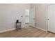 Bedroom featuring wood floors, a black accent table and white trim at 7892 Nookfield Dr, Las Vegas, NV 89147