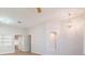 Living room featuring wood floors, arched doorways, recessed lighting, and stylish decorative lighting at 7892 Nookfield Dr, Las Vegas, NV 89147
