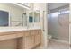 Open bathroom featuring a single sink vanity and accessible tub shower at 8901 Litchfield Ave, Las Vegas, NV 89134