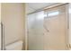 This bathroom has a stand-up shower with glass doors and accessibility hand rails at 8901 Litchfield Ave, Las Vegas, NV 89134