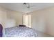 Neutral bedroom featuring a ceiling fan, plush carpeting, and access door at 8901 Litchfield Ave, Las Vegas, NV 89134