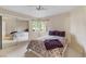 Bright bedroom with large mirror closet, ceiling fan, and window at 8901 Litchfield Ave, Las Vegas, NV 89134