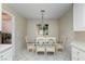 Cozy breakfast nook off the kitchen features a glass table, comfortable chairs, and ample natural light at 8901 Litchfield Ave, Las Vegas, NV 89134