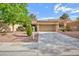 Charming single-story home with a well-manicured front yard and a spacious driveway at 8901 Litchfield Ave, Las Vegas, NV 89134