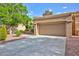 Spacious two-car garage with a large driveway, perfect for parking and storage at 8901 Litchfield Ave, Las Vegas, NV 89134