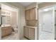 Functional laundry room with ample storage and access to bathroom at 8901 Litchfield Ave, Las Vegas, NV 89134