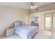 Spacious bedroom featuring a stylish ceiling fan and neutral decor at 8901 Litchfield Ave, Las Vegas, NV 89134