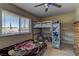 Bright bedroom with a bunk bed, plenty of storage, and a window for natural light at 893 Fairway Dr, Boulder City, NV 89005