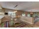 Cozy dining area featuring a fireplace, wooden table, and a view of the backyard at 893 Fairway Dr, Boulder City, NV 89005