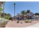 A charming home with desert landscaping and a mature palm tree in the front yard at 893 Fairway Dr, Boulder City, NV 89005