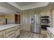 Bright kitchen with wood-look floors, custom cabinets, and stainless steel appliances at 893 Fairway Dr, Boulder City, NV 89005