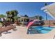 Beautiful backyard with a sparkling pool, spa, and lush landscaping at 893 Fairway Dr, Boulder City, NV 89005