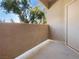 Exterior balcony with concrete flooring and door to interior with natural outdoor background at 8985 S Durango Dr # 2081, Las Vegas, NV 89113