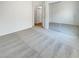 Bright bedroom featuring plush carpeting, mirrored closet doors, and an ensuite bathroom, offering comfort and convenience at 8985 S Durango Dr # 2081, Las Vegas, NV 89113