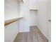 Walk-in closet with carpet floor and built-in shelves at 8985 S Durango Dr # 2081, Las Vegas, NV 89113
