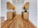 Galley style kitchen with wood cabinets and granite countertops at 8985 S Durango Dr # 2081, Las Vegas, NV 89113