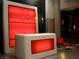 Contemporary lobby with modern reception desk, red accent lighting, and stylish decor at 900 Las Vegas Blvd # 1113, Las Vegas, NV 89101